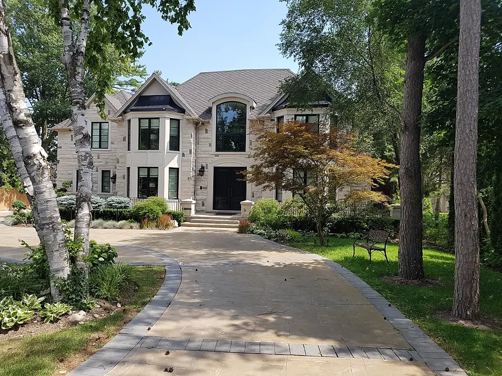 Interlock driveway and landscaped front entrance by A&R Lifestyle